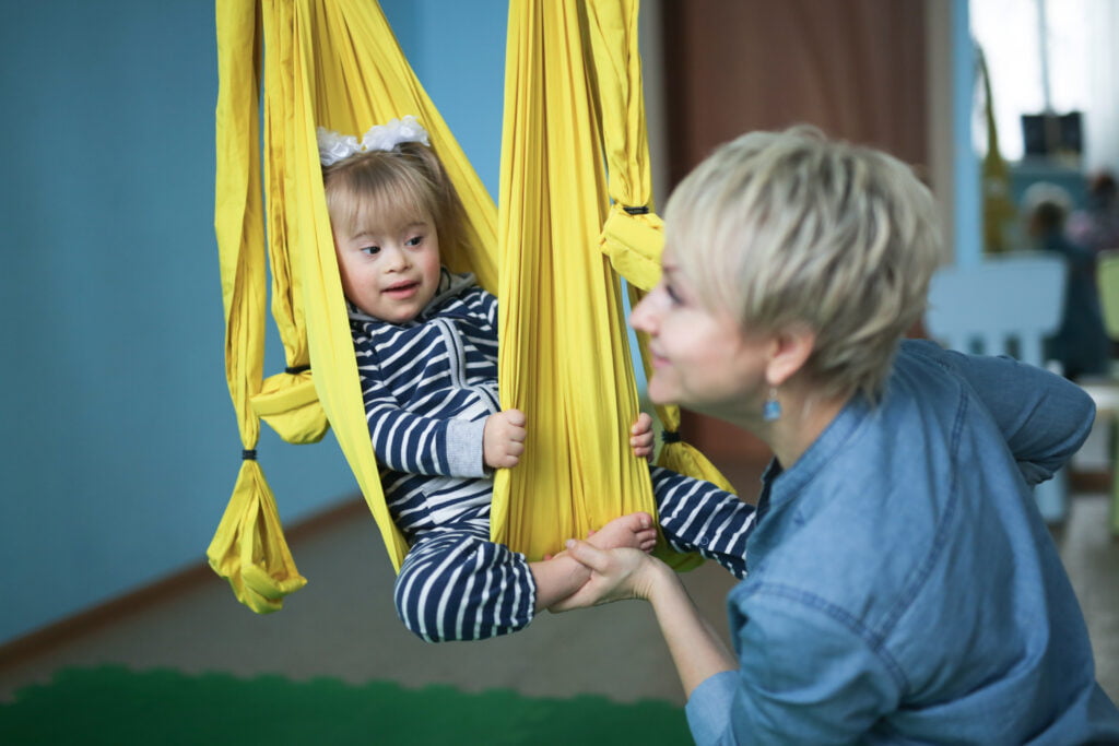 Doing yoga is mom and child Toddler Down syndrome